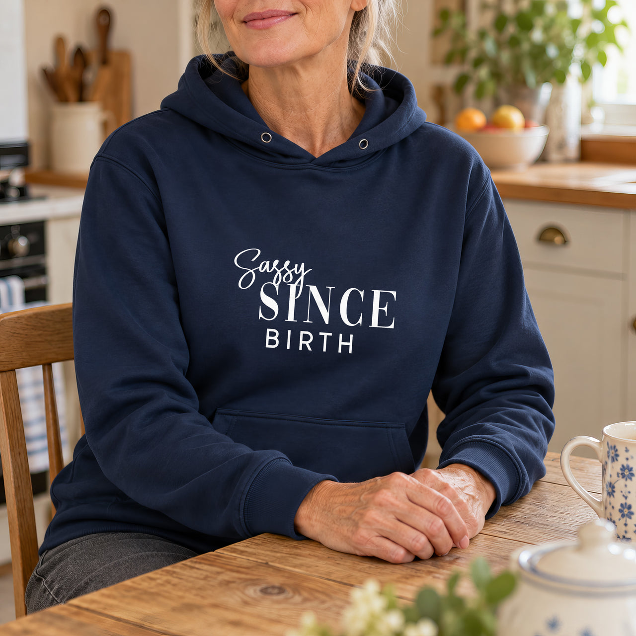 Navy hoodie with the Sassy Since Birth design printed on the chest
