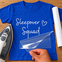 Royal blue T-shirt with white 'Sleepover Squad' iron-on transfer in handwritten script with heart, iron and white vinyl roll