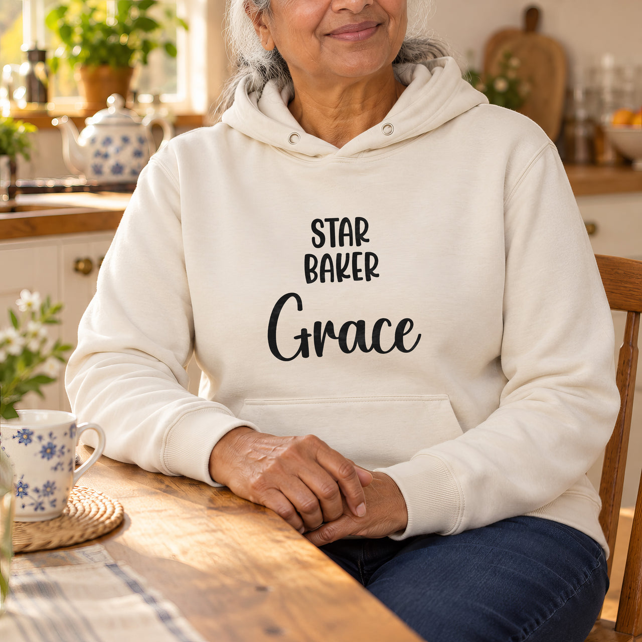 Star Baker Iron-On Transfer - Personalised Name Design, shown on a natural hoodie