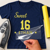 Sweet 16 iron-on transfer: yellow Sweet 16 ETHAN on a navy T-shirt, film being peeled