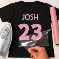 Table Tennis Shirt Name Number iron-on transfer: pink JOSH 23 on a black T-shirt, film being peeled
