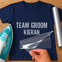 Navy T-shirt with grey 'TEAM GROOM KIERAN' name iron-on transfer in condensed capitals, iron and silver vinyl roll