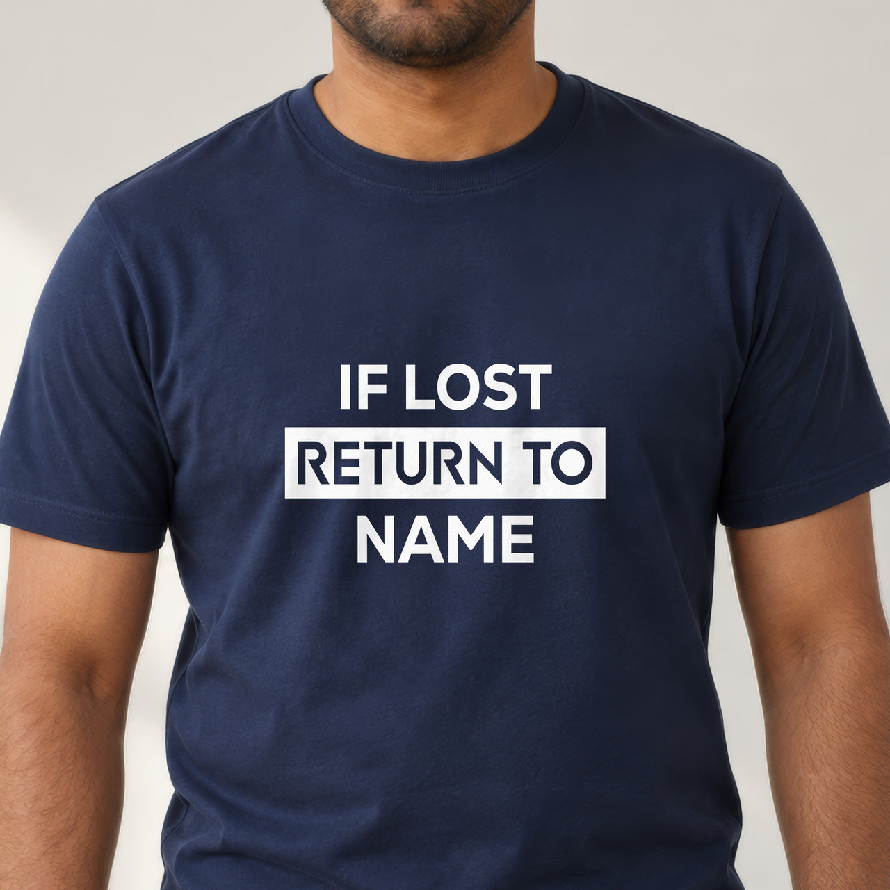 If lost return to name on a navy T-shirt