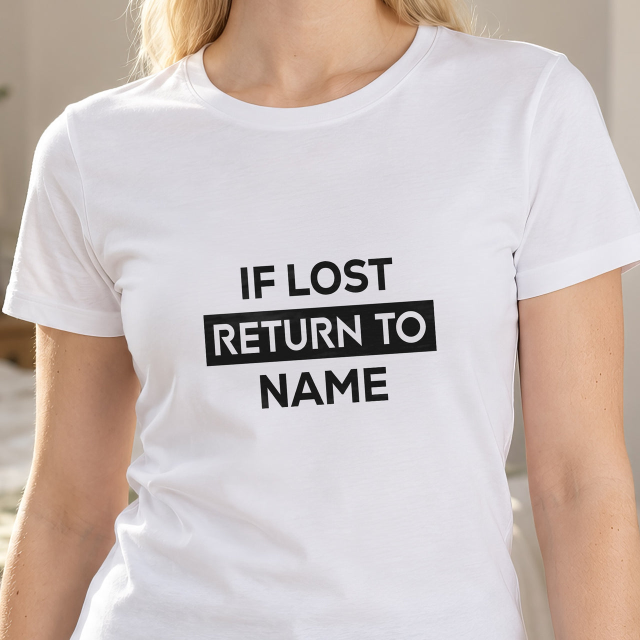If lost return to name on a white T-shirt