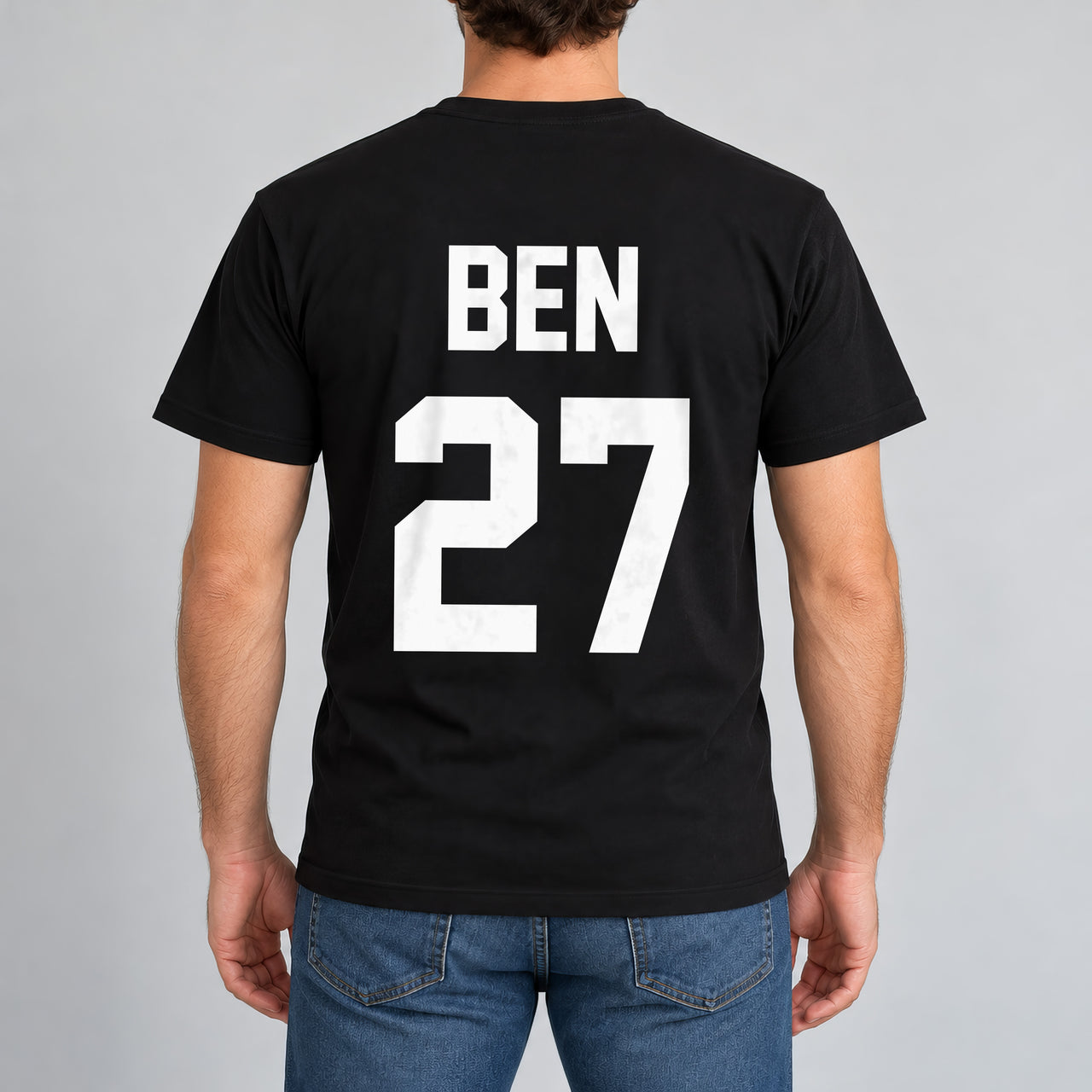 Black T-shirt with the Training Kit Name and Number design printed on the back