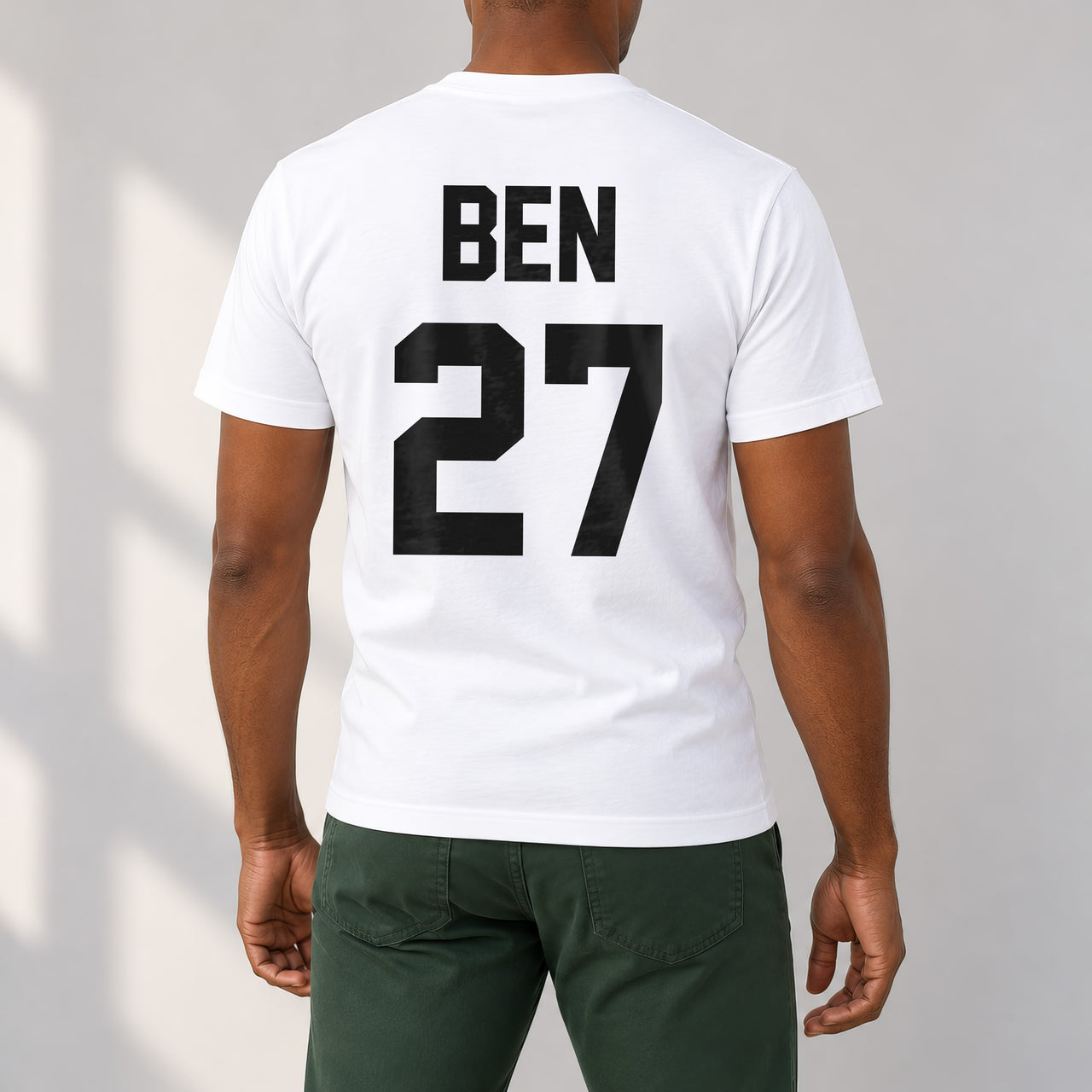 White T-shirt with the Training Kit Name and Number design printed on the back