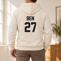 Sand hoodie with the Training Kit Name and Number design printed on the back