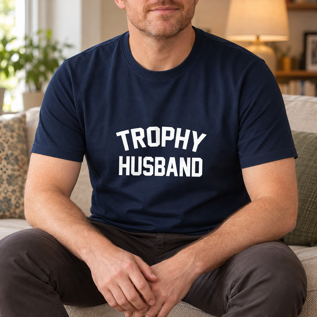 Navy T-shirt with the Trophy Husband design printed on the chest
