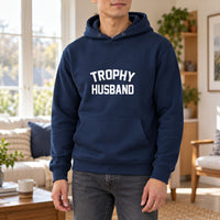 Navy hoodie with the Trophy Husband design printed on the chest
