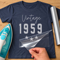 Navy T-shirt with silver 'Vintage 1959' and three stars, retro birth year HTV transfer shown with iron and roll