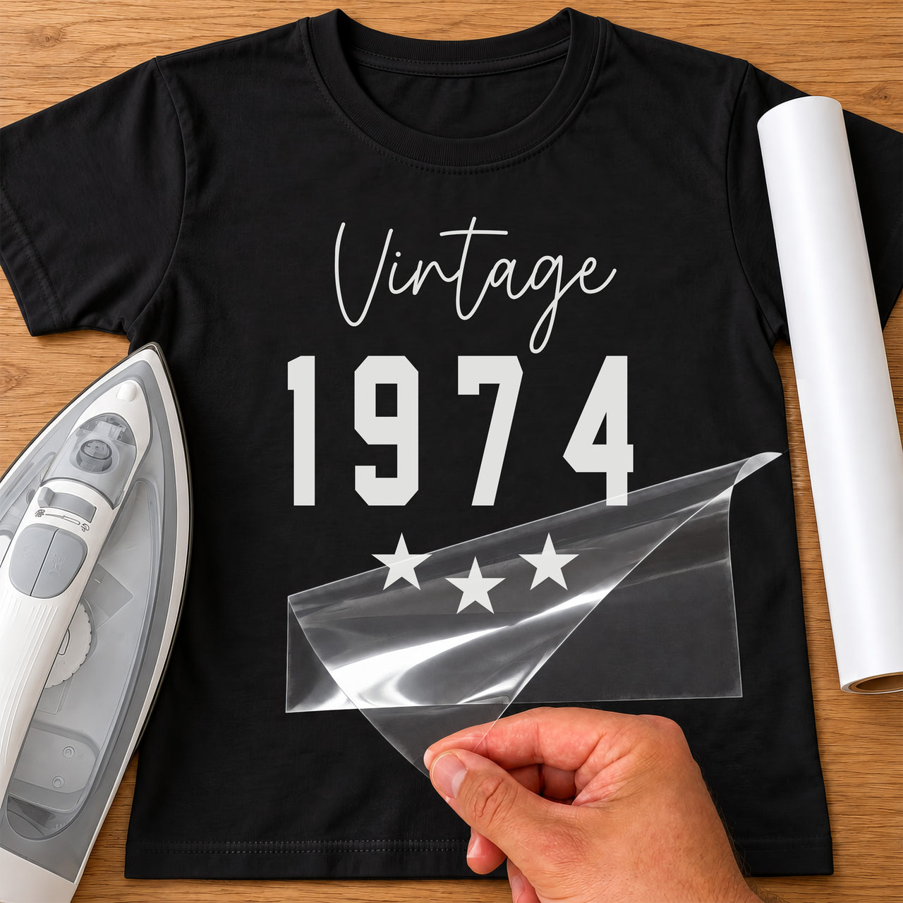 Black T-shirt with white script 'Vintage', bold '1974' and three stars, retro birth year iron-on transfer