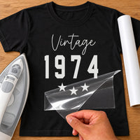 Black T-shirt with white script 'Vintage', bold '1974' and three stars, retro birth year iron-on transfer