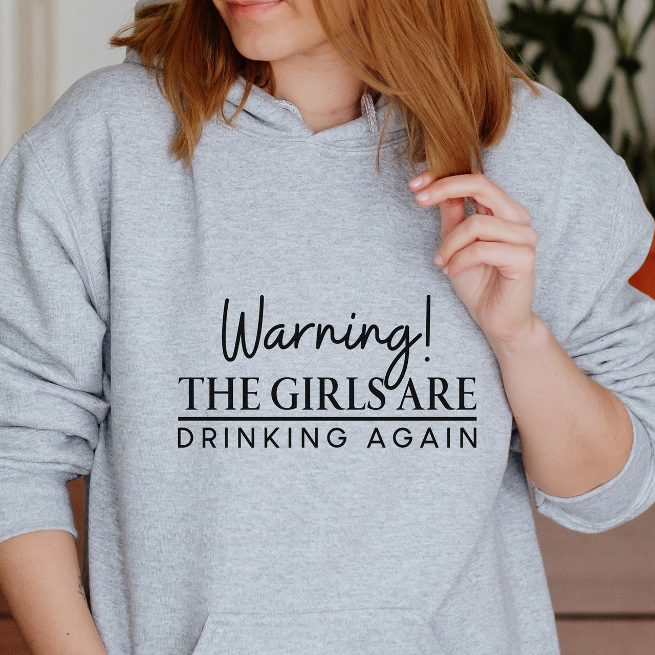 Warning The Girls Are Drinking Again Iron-On Transfer - Hen Party Design shown on a hoodie
