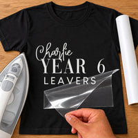 Year 6 Leavers iron-on transfer: white Charlie YEAR 6 LEAVERS on a black T-shirt, film being peeled