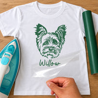 Yorkshire Terrier iron-on transfer: green Yorkshire Terrier face with the name Willow on a white T-shirt, film being peeled