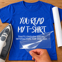 Slogan iron-on transfer: white YOU READ MY T-SHIRT. THAT'S ENOUGH SOCIAL INTERACTION FOR ONE DAY. on a blue T-shirt
