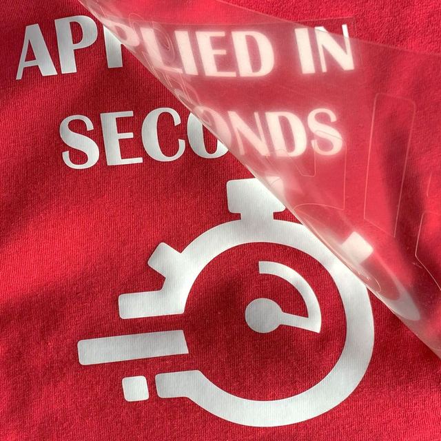 Red T-shirt with white matte lettering, clear carrier half peeled